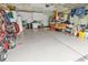 Spacious garage featuring plenty of storage space with cabinets, shelves and an epoxy floor at 6434 Longwood Dr., Murrells Inlet, SC 29576