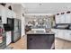 Modern kitchen with stainless steel appliances, an island, and seamless flow to the adjacent living spaces at 6434 Longwood Dr., Murrells Inlet, SC 29576