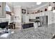Well-appointed kitchen boasts granite counters, stainless steel appliances, and a functional center island at 6434 Longwood Dr., Murrells Inlet, SC 29576