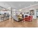 Bright and airy living room showcasing an open floor plan, fireplace, and seamless transition to kitchen at 6434 Longwood Dr., Murrells Inlet, SC 29576