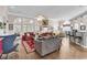 Spacious living room featuring hardwood floors, a fireplace, and large windows offering great natural light at 6434 Longwood Dr., Murrells Inlet, SC 29576