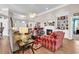 Cozy living room featuring a fireplace, comfortable seating, built-in shelving, and ample natural light at 6434 Longwood Dr., Murrells Inlet, SC 29576