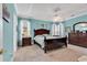 The primary suite offers a decorative tray ceiling, two windows and stylish, matching furniture at 6434 Longwood Dr., Murrells Inlet, SC 29576
