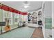 Bright office features a custom built-in bookcase, desk space, and natural light at 6434 Longwood Dr., Murrells Inlet, SC 29576