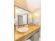 Bathroom vanity featuring granite countertops, an oval sink, and large framed mirror at 6900 N Ocean Blvd. # 840, Myrtle Beach, SC 29572