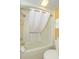 Clean bathroom area features a shower and tub combination with white curtain, toilet, and towel rack at 6900 N Ocean Blvd. # 840, Myrtle Beach, SC 29572