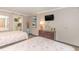 Bedroom features two beds with patterned coral bedding, chest of drawers, and flat screen TV at 6900 N Ocean Blvd. # 840, Myrtle Beach, SC 29572