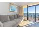 Bright living room with comfortable seating, ocean view balcony, and modern decor at 6900 N Ocean Blvd. # 840, Myrtle Beach, SC 29572