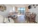 Cozy living room with ocean view balcony, comfortable sofas, and dining area at 6900 N Ocean Blvd. # 840, Myrtle Beach, SC 29572