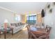 Bright living room with ocean view balcony, comfortable seating, and dining area at 6900 N Ocean Blvd. # 840, Myrtle Beach, SC 29572