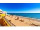 Stunning ocean view patio featuring lounge chairs, hammocks, and decorative potted plants at 6900 N Ocean Blvd. # 840, Myrtle Beach, SC 29572