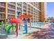 Bright and fun waterpark with colorful features located at resort pool with a large building backdrop at 6900 N Ocean Blvd. # 840, Myrtle Beach, SC 29572