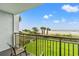 Relaxing balcony view featuring beach, chairs and fenced lawn at 7200 N Ocean Blvd. # 222, Myrtle Beach, SC 29572