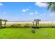 Beautiful beach view with palm trees, green grass and scattered clouds at 7200 N Ocean Blvd. # 222, Myrtle Beach, SC 29572
