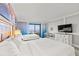 Inviting bedroom featuring large beds, a dresser, and view of the beach at 7200 N Ocean Blvd. # 222, Myrtle Beach, SC 29572
