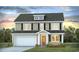 Charming two-story home with black shutters, a well-kept lawn, and a welcoming front entrance at 721 Doonbeg Ct., Conway, SC 29526