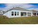 Lovely backyard featuring a covered patio and manicured lawn, perfect for entertaining at 725 Doonbeg Ct., Conway, SC 29526