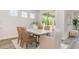 Charming dining room with a rustic table and wicker chairs near a bright sliding glass door at 729 Doonbeg Ct., Conway, SC 29526