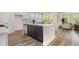This kitchen features a center island, modern appliances, and hardwood flooring at 729 Doonbeg Ct., Conway, SC 29526