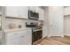 Contemporary kitchen with stainless steel appliances, designer backsplash, and bright lighting at 729 Doonbeg Ct., Conway, SC 29526