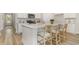 Modern kitchen with quartz countertops, island seating, stainless appliances, and stylish white cabinets at 729 Doonbeg Ct., Conway, SC 29526