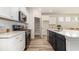 Modern kitchen with stainless steel appliances, quartz countertops, and open pantry with lots of storage at 729 Doonbeg Ct., Conway, SC 29526