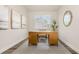 Stylish home office with decorative rug, wood desk, interior decor, and bright natural light at 729 Doonbeg Ct., Conway, SC 29526