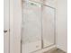 Modern tiled walk-in shower with glass doors and chrome fixtures at 729 Doonbeg Ct., Conway, SC 29526