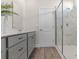 Bright bathroom featuring a vanity with a white countertop and a marble tiled shower at 733 Doonbeg Ct., Conway, SC 29526