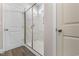 Bright bathroom featuring a tiled shower with a glass enclosure and modern fixtures at 733 Doonbeg Ct., Conway, SC 29526