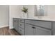 Modern bathroom featuring gray cabinets, double sinks, and a spacious walk-in shower at 733 Doonbeg Ct., Conway, SC 29526