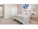 This cozy bedroom features carpet and a bed with blue accents and bedside tables with lamps at 733 Doonbeg Ct., Conway, SC 29526