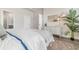 Comfortable bedroom with white furnishings, a cozy woven headboard, and stylish decor at 733 Doonbeg Ct., Conway, SC 29526