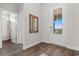 Entryway features wood-look floors, a half-glass door, and a stylish mirror at 733 Doonbeg Ct., Conway, SC 29526