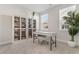 Home office with built in bookshelf, modern desk, neutral paint, large window, and carpeted floor at 733 Doonbeg Ct., Conway, SC 29526