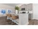 Modern kitchen with gray cabinets, quartz countertops, and island seating at 733 Doonbeg Ct., Conway, SC 29526