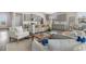 Open-concept living space with a view of the kitchen and dining area featuring modern furnishings at 733 Doonbeg Ct., Conway, SC 29526