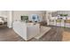 Cozy living room with modern furniture, a TV, and an open view into the kitchen at 733 Doonbeg Ct., Conway, SC 29526