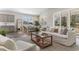 Open-concept living space and dining area with modern furnishings and lots of natural light at 733 Doonbeg Ct., Conway, SC 29526