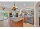 Open kitchen with granite countertops, stainless appliances, large island, and seamless access to the living areas at 773 Wintercreeper Dr., Longs, SC 29568
