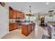 Open kitchen featuring granite countertops, stainless steel appliances, and a center island with a dining area at 773 Wintercreeper Dr., Longs, SC 29568