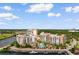 An aerial view showcases a luxurious waterfront complex in the Grande Dunes community at 8121 Amalfi Pl. # 4-1006, Myrtle Beach, SC 29572