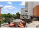 Outdoor patio area featuring comfortable seating, an outdoor dining table, and a serene view of the surrounding landscape at 8121 Amalfi Pl. # 4-1006, Myrtle Beach, SC 29572