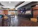 The stylish bar area features a dark wood bar, ample seating, and a selection of beverages at 8121 Amalfi Pl. # 4-1006, Myrtle Beach, SC 29572