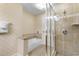 Tiled bathroom featuring a tub and a separate glass-enclosed shower at 8121 Amalfi Pl. # 4-1006, Myrtle Beach, SC 29572