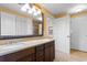Bathroom featuring double sinks, granite countertops, decorative mirror and tile flooring at 8121 Amalfi Pl. # 4-1006, Myrtle Beach, SC 29572