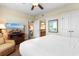 Comfortable bedroom with a large bed, TV, access to the bathroom, and closet space at 8121 Amalfi Pl. # 4-1006, Myrtle Beach, SC 29572