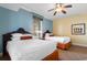 Bright bedroom with two beds, ceiling fan, and natural light from the window at 8121 Amalfi Pl. # 4-1006, Myrtle Beach, SC 29572