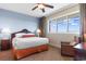 Cozy bedroom with a king-sized bed, bedside tables, lamps, and a large window with natural light at 8121 Amalfi Pl. # 4-1006, Myrtle Beach, SC 29572