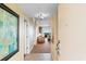 View from the unit entry to a living area with balcony and seating at 8121 Amalfi Pl. # 4-1006, Myrtle Beach, SC 29572